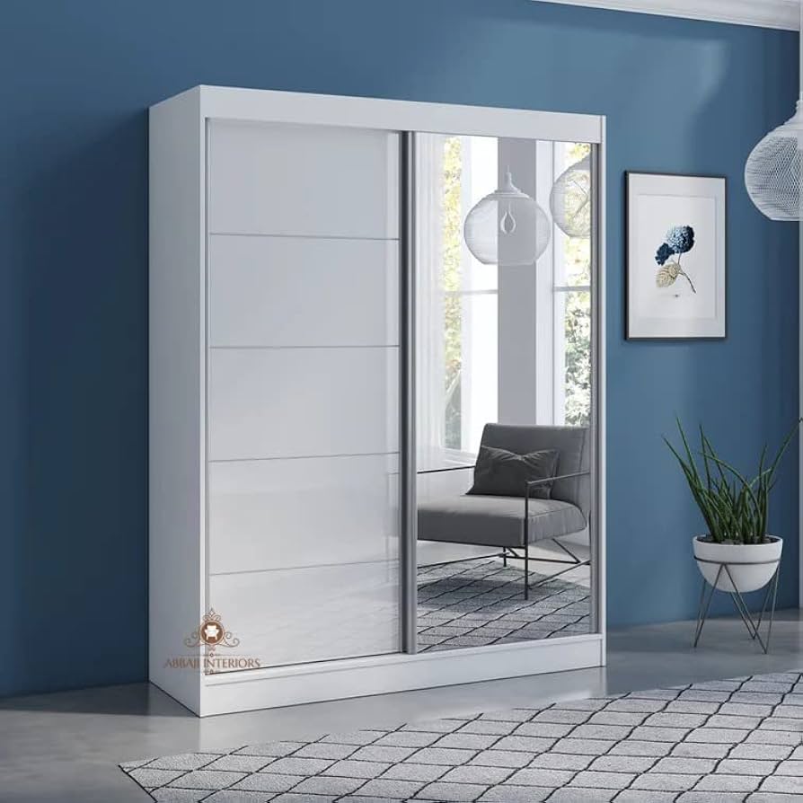 White sliding door wardrobe with a mirrored panel and integrated shelving